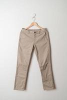 trousers or long pants hanging on wall photo