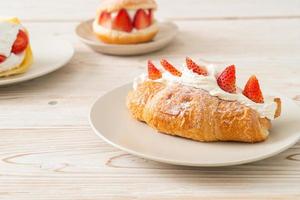 strawberry fresh cream croissant on plate photo