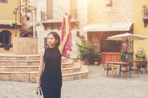 Young beautiful woman with retro camera , Vintage retro style Asian girl on vacation smiling happy. photo