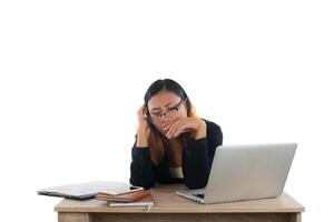 Young business woman tired with her work fall asleep at her desk isolated on white background. photo