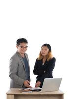 Young business woman standing with her boss conversation about the business at office isolated on white background. photo