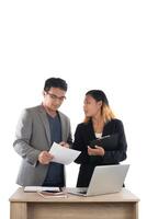 Young business woman standing with her boss conversation about the business at office isolated on white background. photo