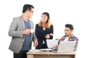 Portrait of business partners discussing documents and ideas at meeting in office isolated on white background. photo