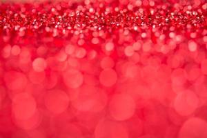 Red bokeh holiday textured Christmas decorations background photo