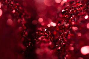 Red bokeh holiday textured Christmas decorations background photo