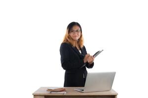 Portrait of businesswoman holding report standing at workplace isolated on white background. photo
