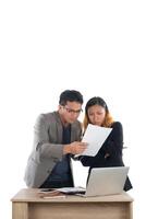 Young business woman standing with her boss conversation about the business at office isolated on white background. photo