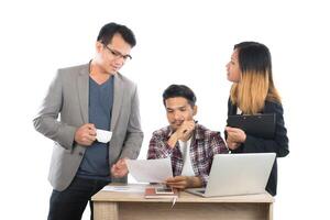 Portrait of business partners discussing documents and ideas at meeting in office isolated on white background. photo