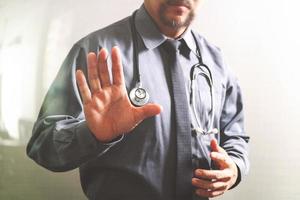 smart medical doctor opening his hand, touch screen computer,stethoscope ,front view,filter effect photo