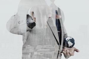 Double exposure of businessman working with new modern computer show social network structure and london city as concept photo