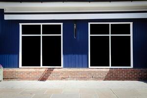 Shopfront vintage store front with canvas awnings and blank display photo