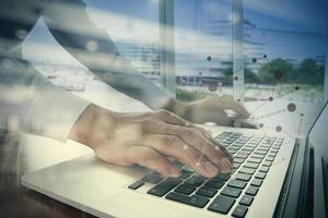 double exposure of businessman hand working with business documents on office table with laptop computer with social media diagram photo