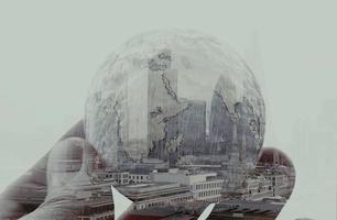 double exposure of businessman hand showing texture the world concept Elements of this image furnished by NASA london city background photo