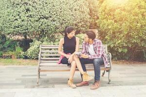 Young hipster couple teenagers in love in the city, Summer holiday enjoyment together. photo