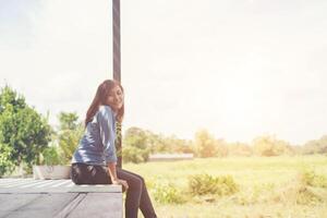 Young hipster woman lounging, relaxing atmosphere in the morning. photo