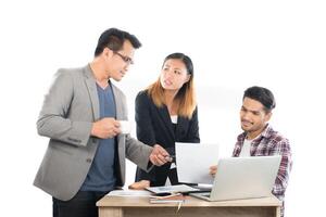 Portrait of business partners discussing documents and ideas at meeting in office isolated on white background. photo