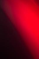 Bright red light on a black background. photo