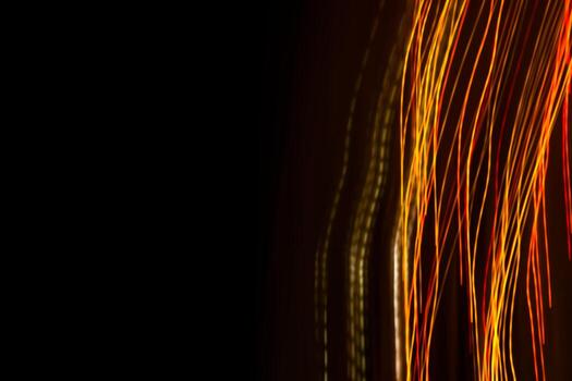 Abstract bright multicolored wavy lines rays on a third of a black background banner. photo