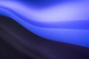 abstract blue neon light on black background. Photo effect, lines and waves.