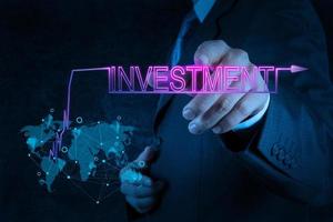 businessman hand pointing to investment photo