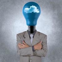 businessman with lightbulb head in the clouds photo