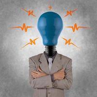 businessman with lamp-head photo