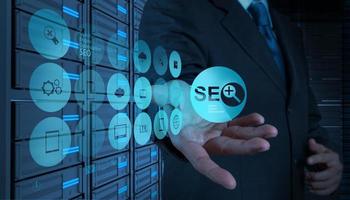 businessman hand showing search engine optimization SEO photo