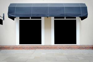 Shopfront vintage store front with canvas awnings and blank display photo