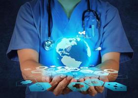 Medical Doctor holding a world globe in her hands as medical network