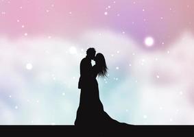 silhouette of a bride and groom on a pastel cotton candy clouds background