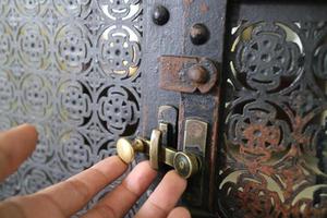 simple lock on scrap metal window photo