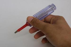 small screwdriver with transparent handle photo