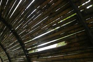 walls made of neat arrangement of bamboo photo