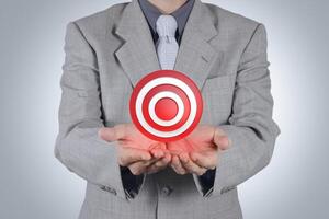 businessman pointing target symbol as success concept photo