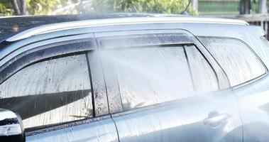 Water mist after spraying to the car for washing. Water was spread to the car while it was spraying. Car concept. video