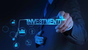 businessman hand pointing to investment concept photo
