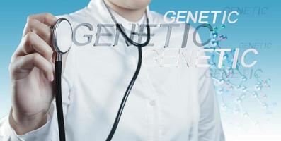 Doctor holds Stethoscope in hand with genetic word photo