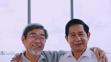 Portrait of two smiling senior men. video