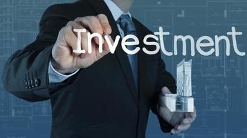 businessman  pointing to investment concept photo