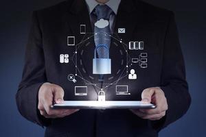 businessman hand pointing to padlock on touch screen computer photo