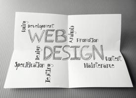 hand drawn web design diagram on crumpled paper background as concept photo