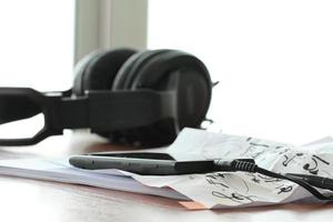 composing music concept with shallow DOF evenly matched jack of headphone and copy space photo