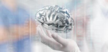 doctor neurologist hand show metal brain with computer interface as concept photo