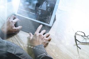 Businessman hand working concept. Photo investor working with new startup project. Digital tablet keyboard dock screen computer design smart phone using. Eyeglass on marble desk. Sun flare effect