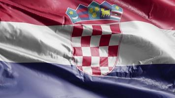 drapeau de la croatie agitant sur la boucle du vent. bannière croate se balançant sur la brise. fond de remplissage complet. Boucle de 10 secondes. video