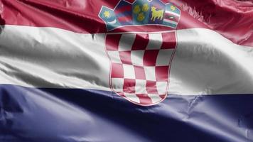 drapeau de la croatie agitant lentement sur la boucle du vent. bannière croate se balançant doucement sur la brise. fond de remplissage complet. Boucle de 20 secondes. video