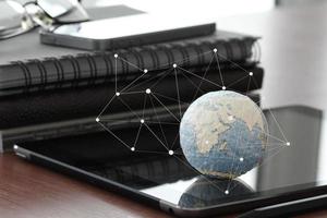 hand drawn texture globe with blank social media diagram on digital tablet computer as internet concept and bokeh exposure photo