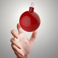 hand showing Empty Christmas ornament photo