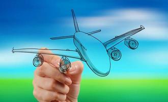 hand drawing airplane on blur blue sky background photo