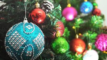 Greeting Season concept.close up of ornaments on a Christmas tree with decorative light photo